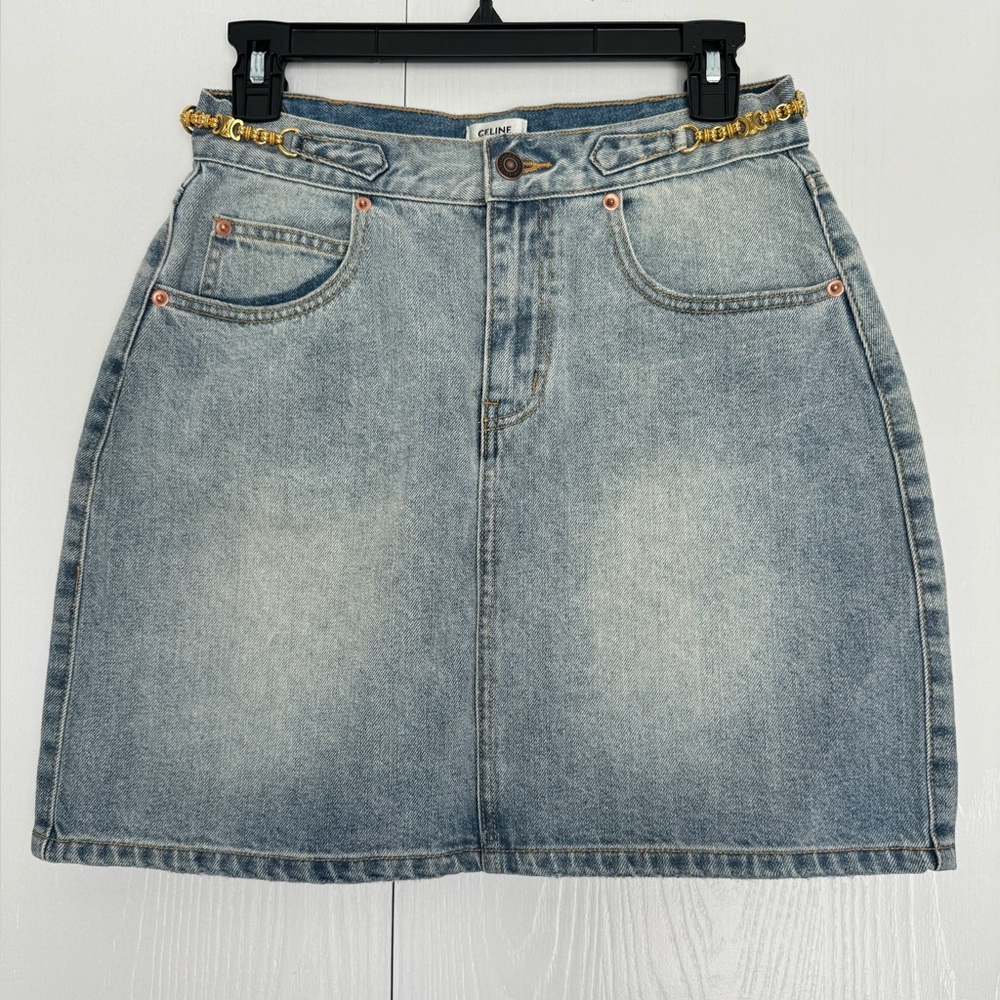 Celine high waisted denim skirt with logo chain details . Medium washed